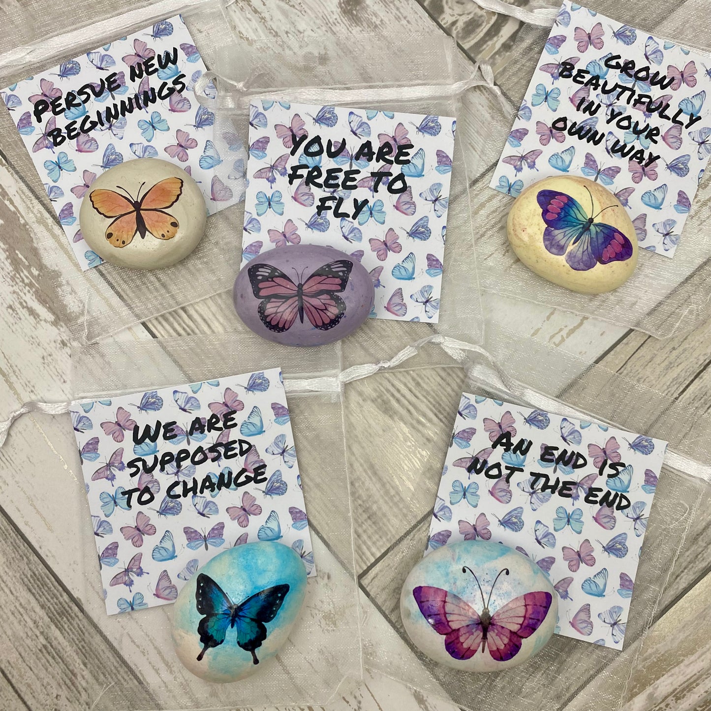 Butterfly decals on marbled pebbles with affirmation cards