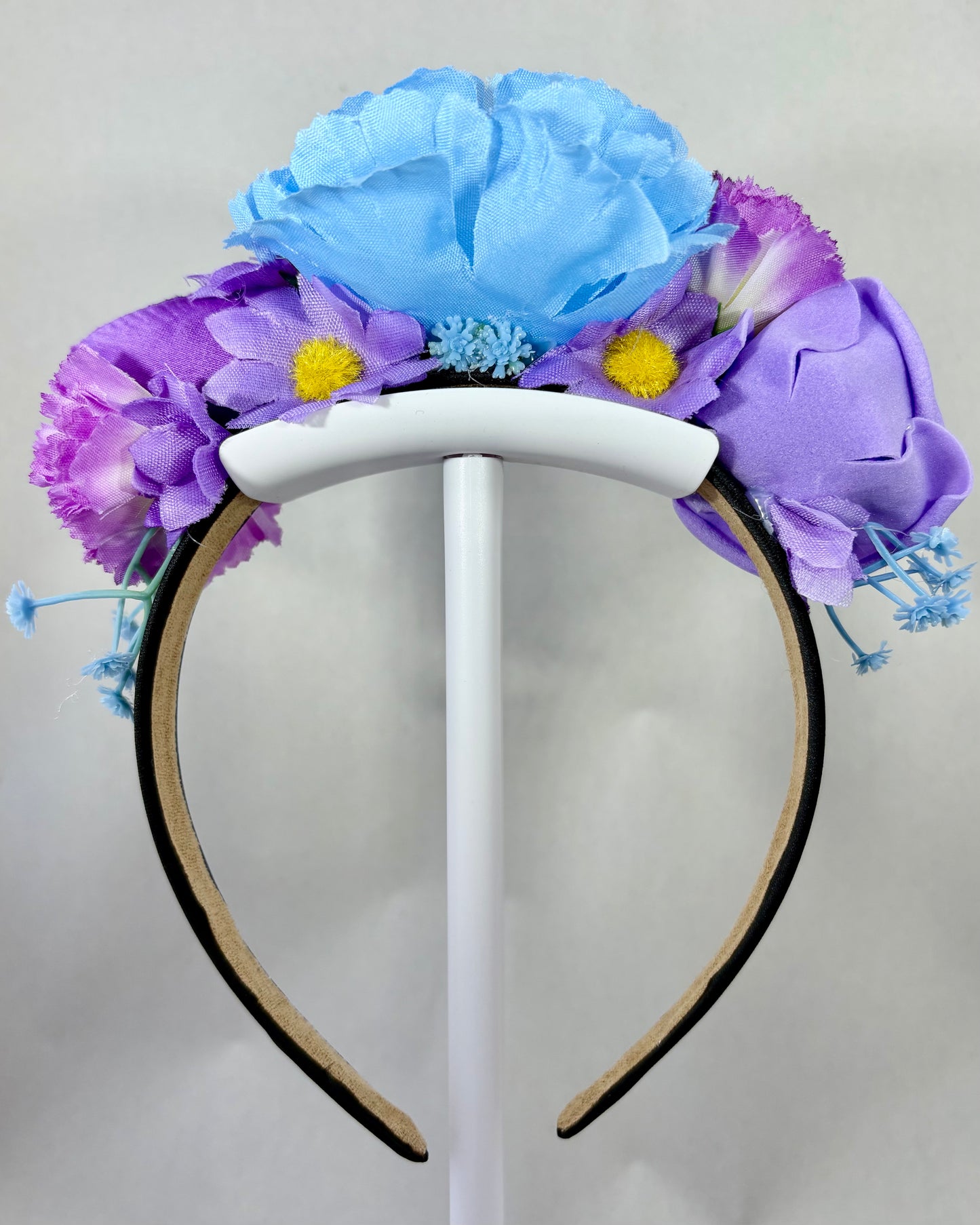 Back of a Floral headband with blue and purple flowers