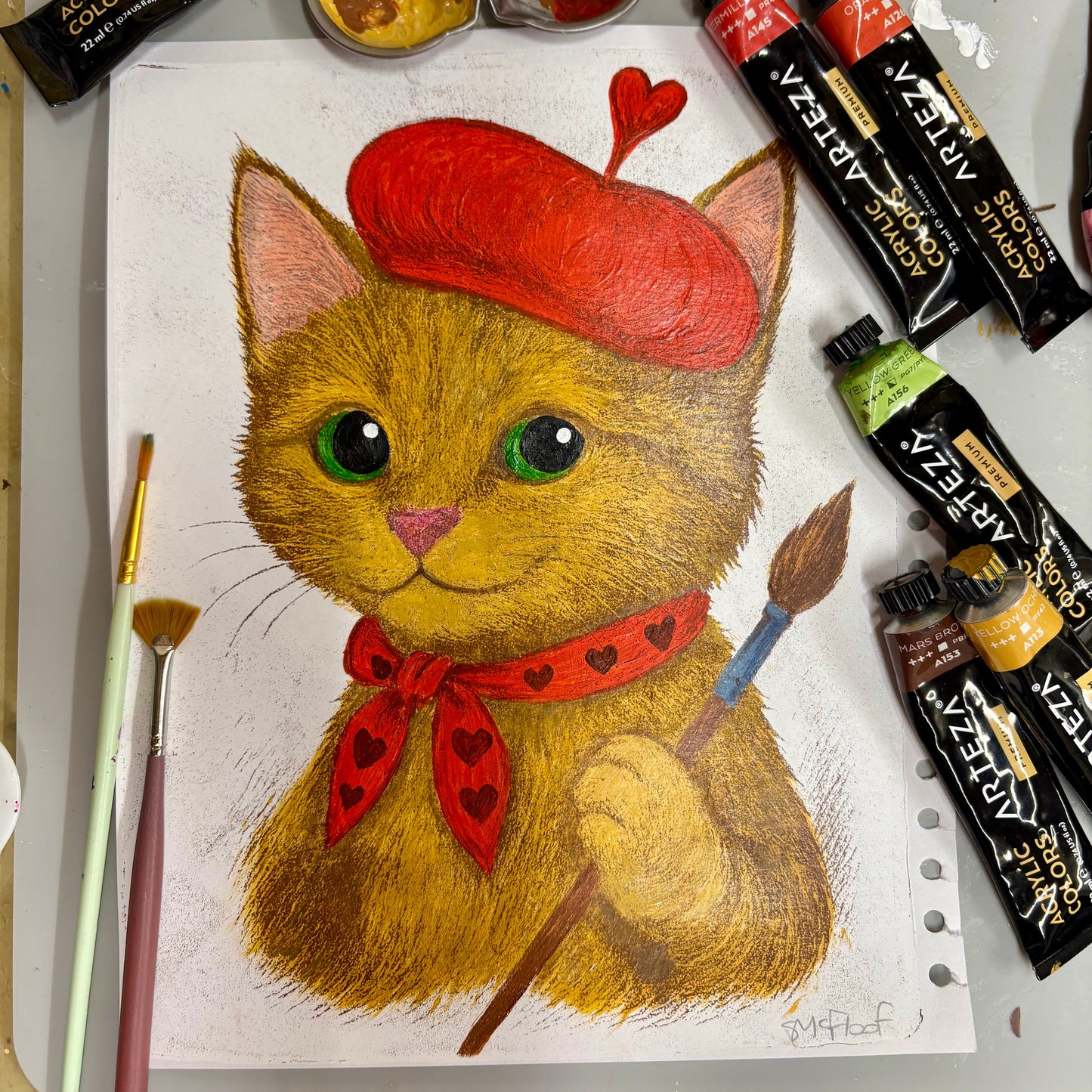 Hand-painted monoprint of a tabby cat in a red beret with a heart feather, holding a paintbrush and wearing a heart scarf. Whimsical original cat artwork from the Cats in Hats series.