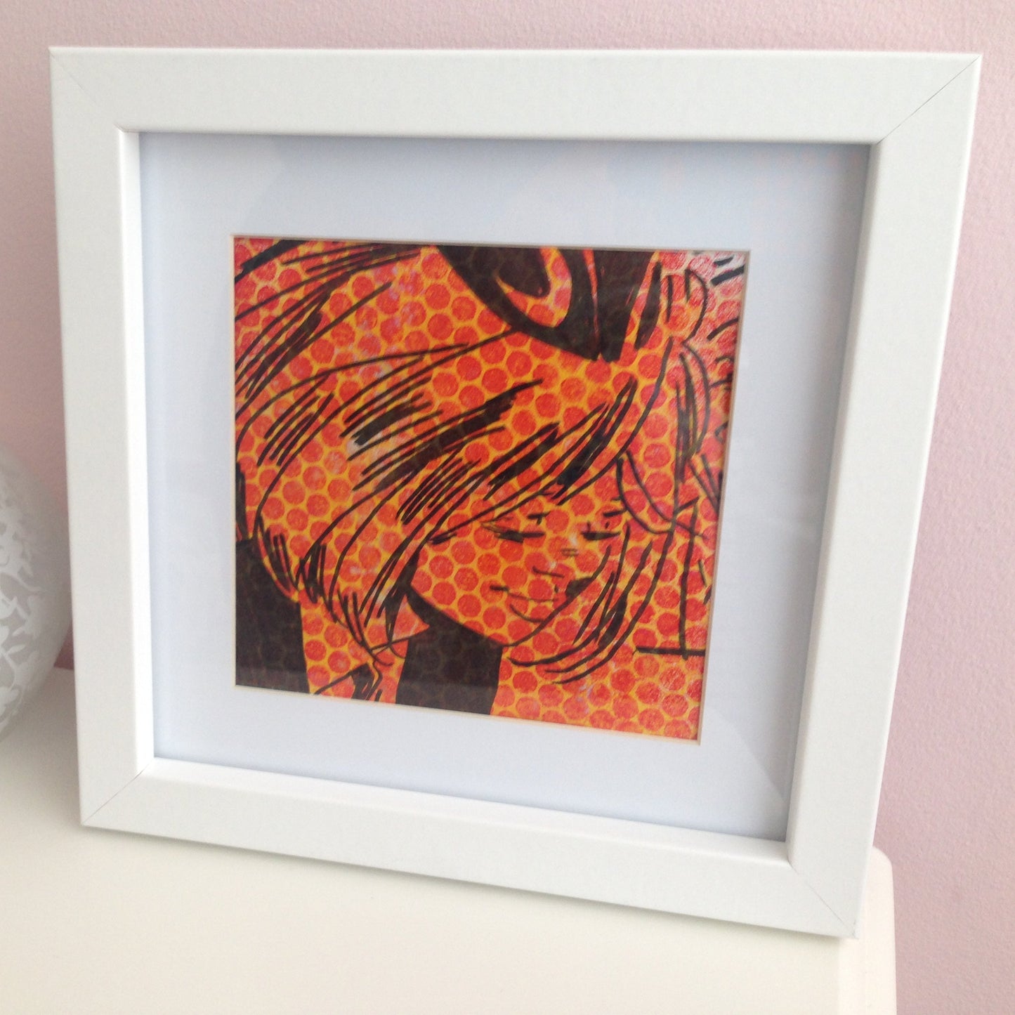 Framed yellow, red and black monoprint of a vintage inspired female character