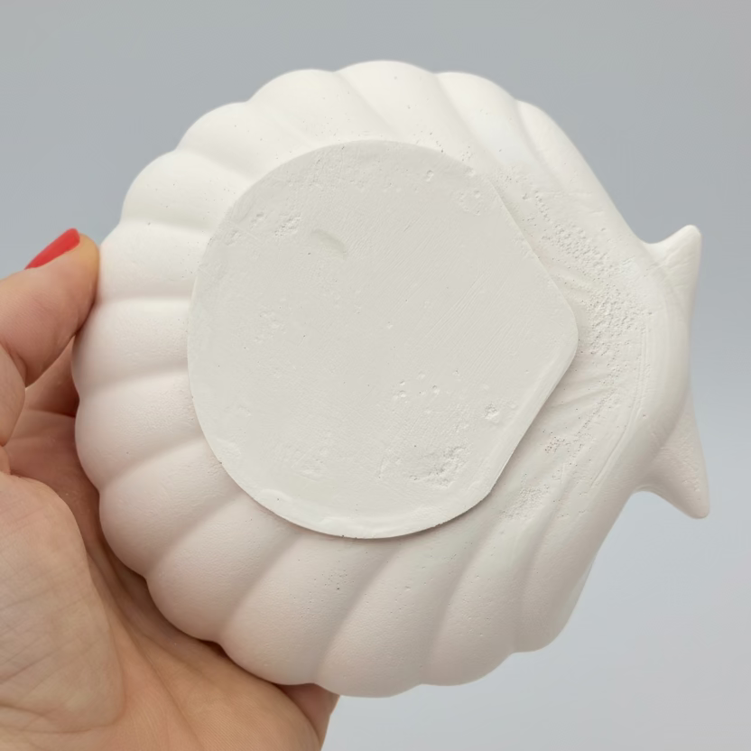 White hand Cast Plaster Shell Trinket Tray ready to paint. Bottom view.
