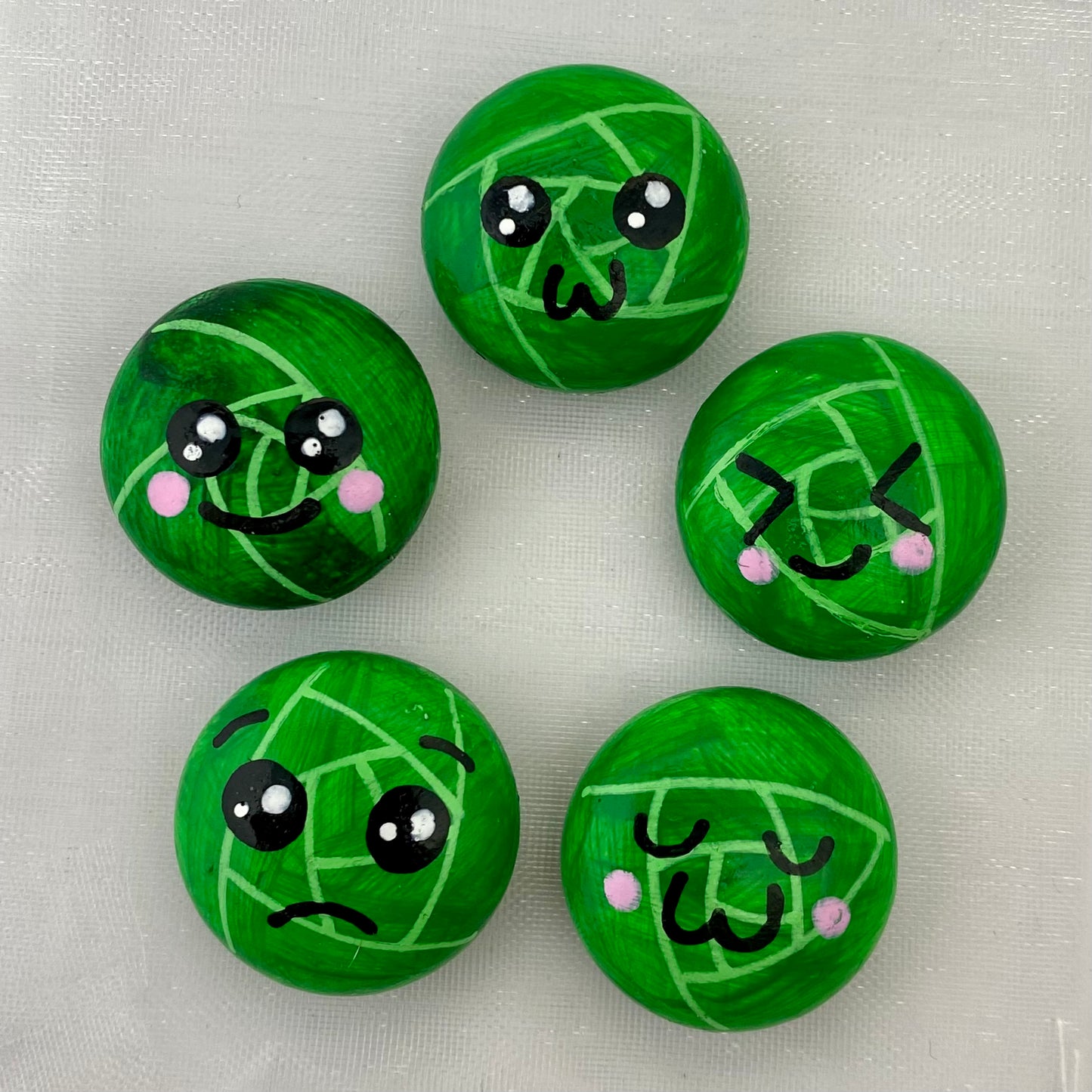 5 Hand painted tiny sprout pebbles each with a different cute faced expression