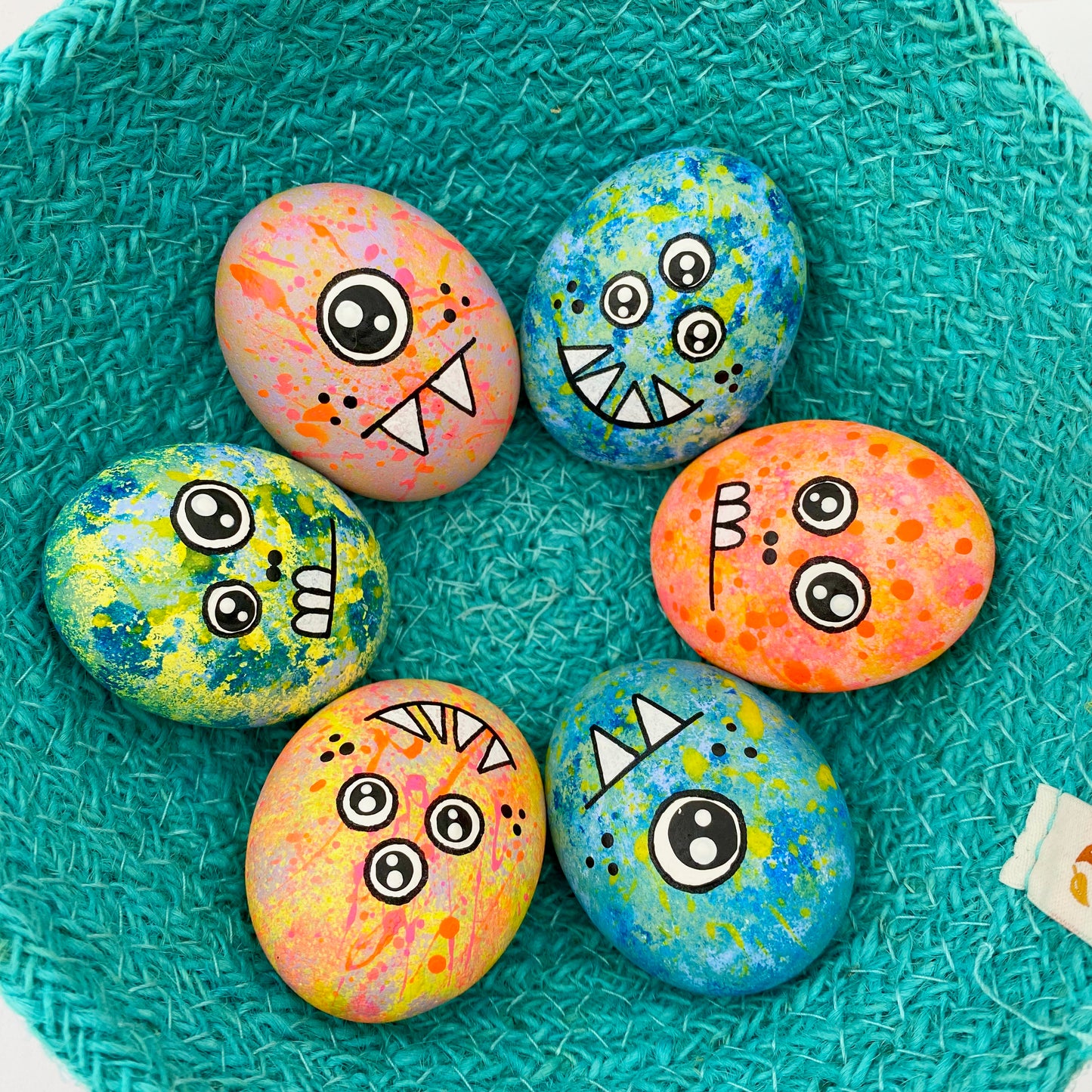 Lots of hand painted Pocket Monster pebbles in a bowl