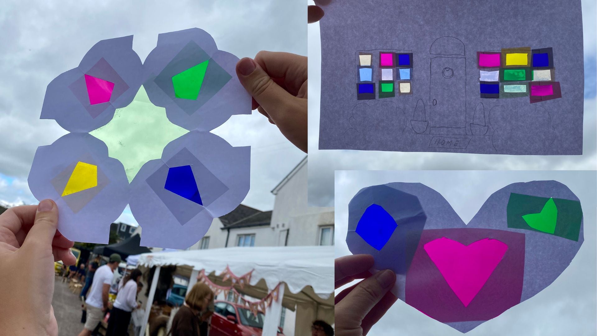 3 colourful suncatchers  made from paper and coloured acetate being held up against the sky. The sun is shining through the coloured acetate. There is a flower shape, a house with colourful windows and a heart shape. There are market stalls in the background.