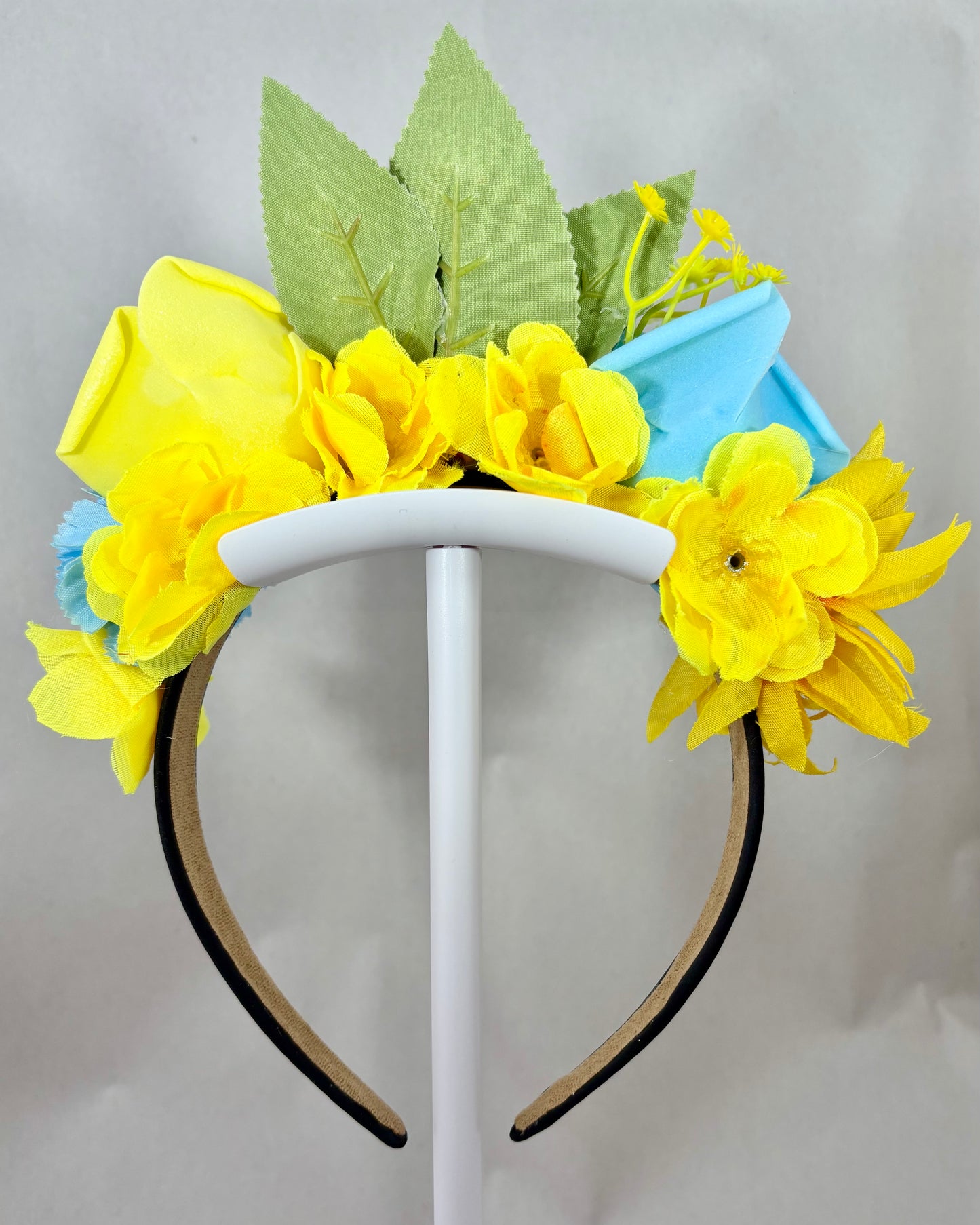 Back of Decorative headband with yellow and blue flowers and green leaves