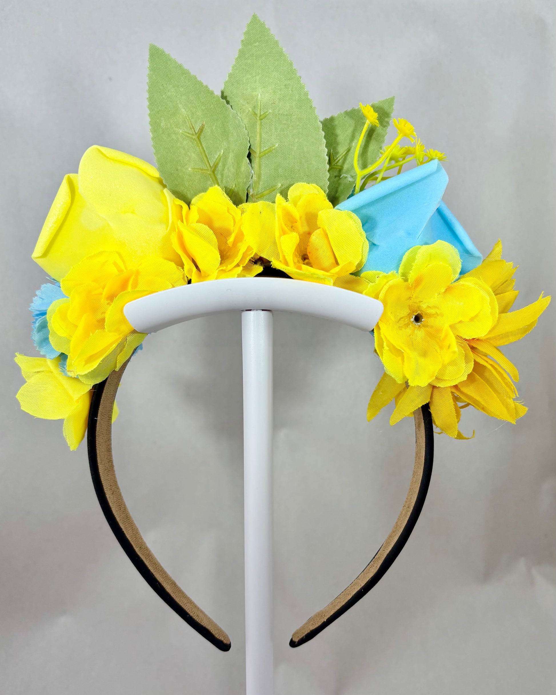 Back of Decorative headband with yellow and blue flowers and green leaves