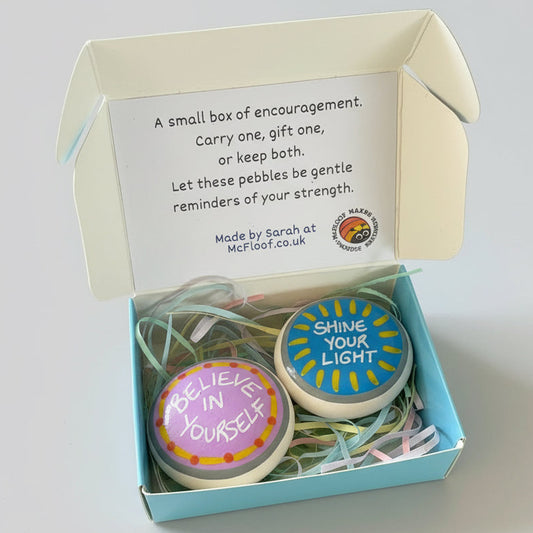 Gift box containing 2 hand painted motivational pebbles.