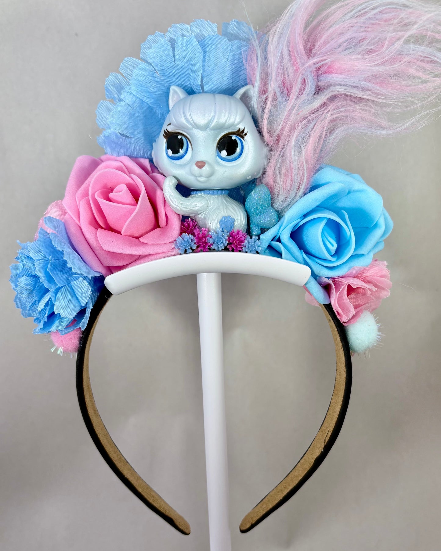 Pale Pink and Blue headband with floral design and small cat toy figure