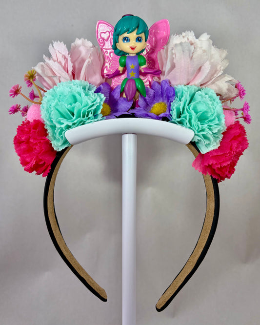 Colourful headband with flowers and a fairy figure