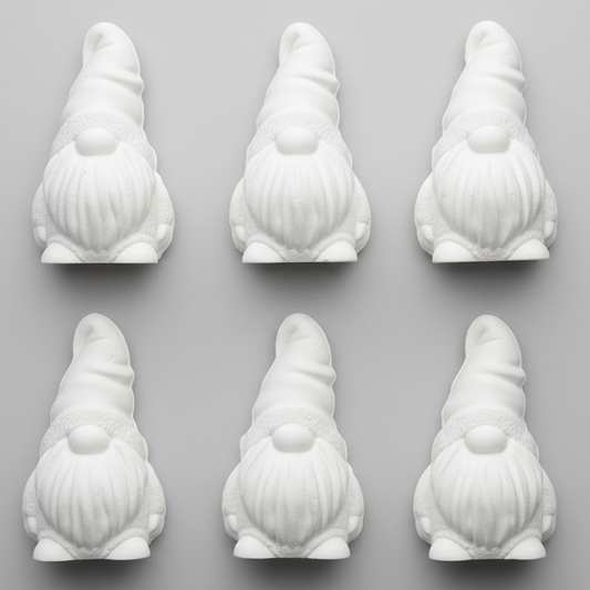 A set of six white, flat-backed mini gnome figures made of plaster.