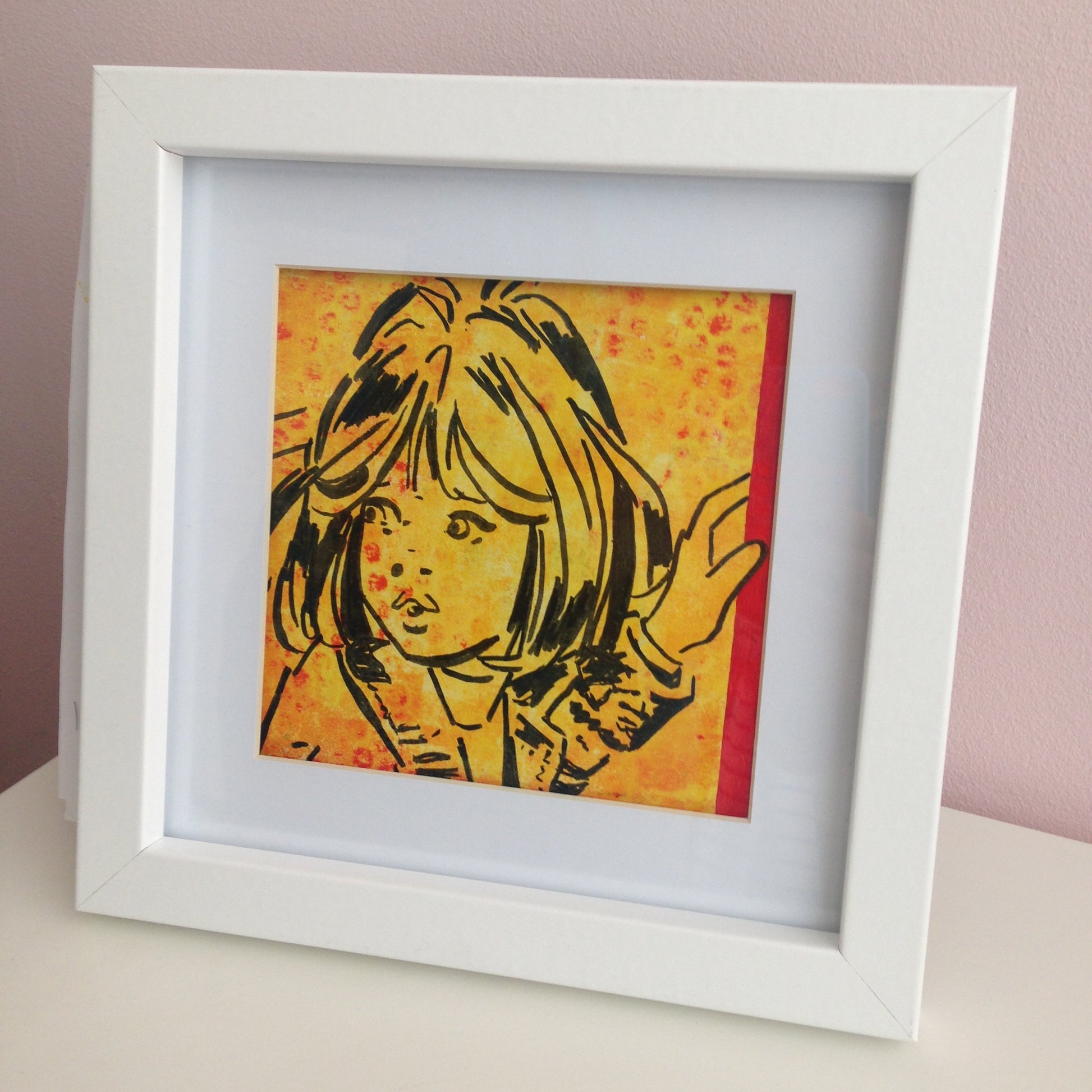 Framed yellow, red and black monoprint of a vintage inspired female character
