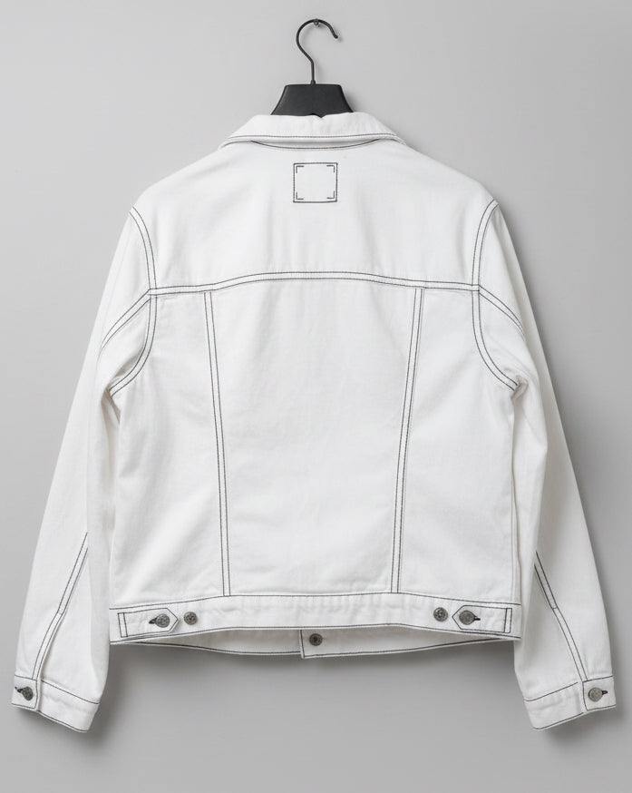 Back of white denim jacket with black outlines painted on