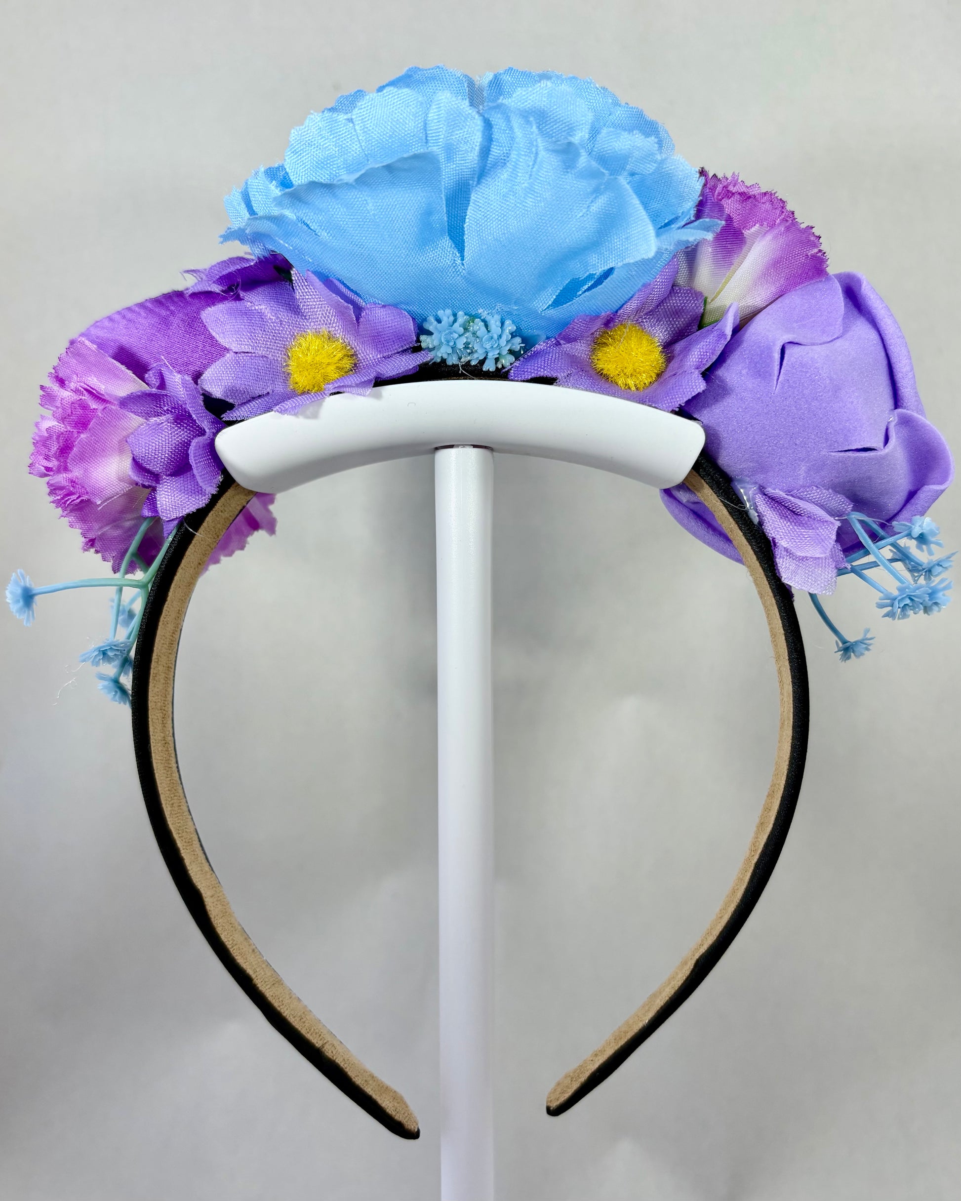 Back of a Floral headband with blue and purple flowers
