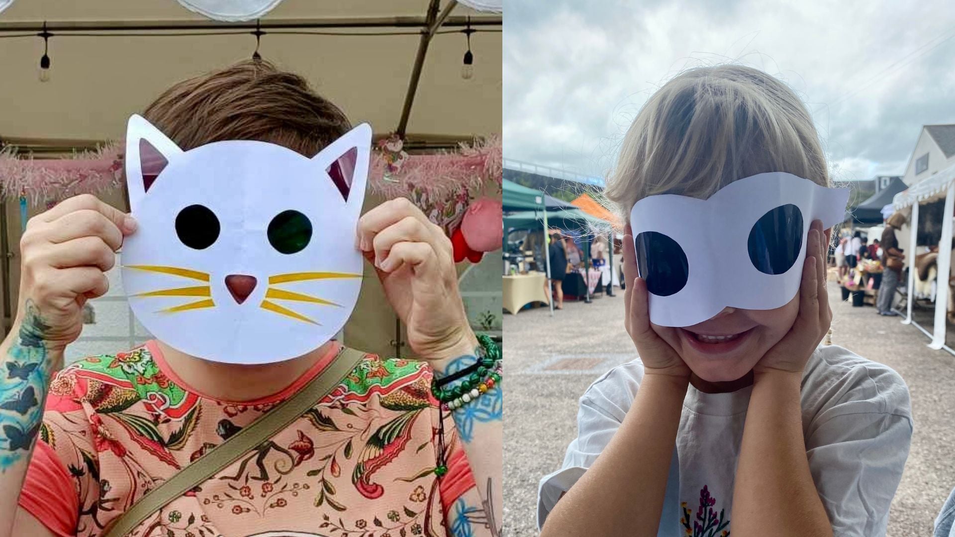 2 colourful mask shaped suncatchers being held up against children's faces, one is cat shaped the other is a superhero mask. They are made from paper and coloured acetate. There are market stalls in the background.