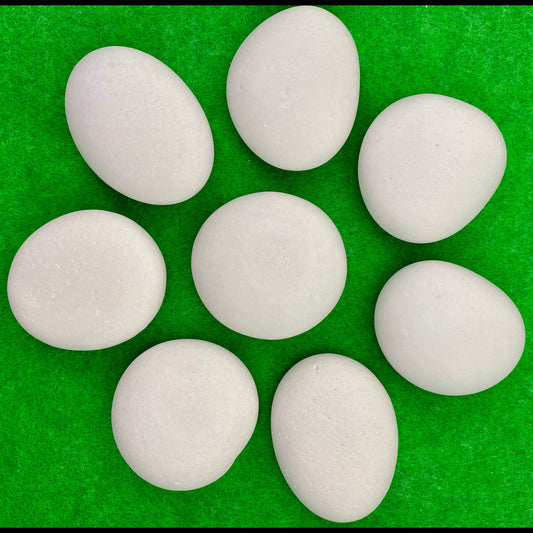 8 small white plaster pebbles of different shapes and sizes