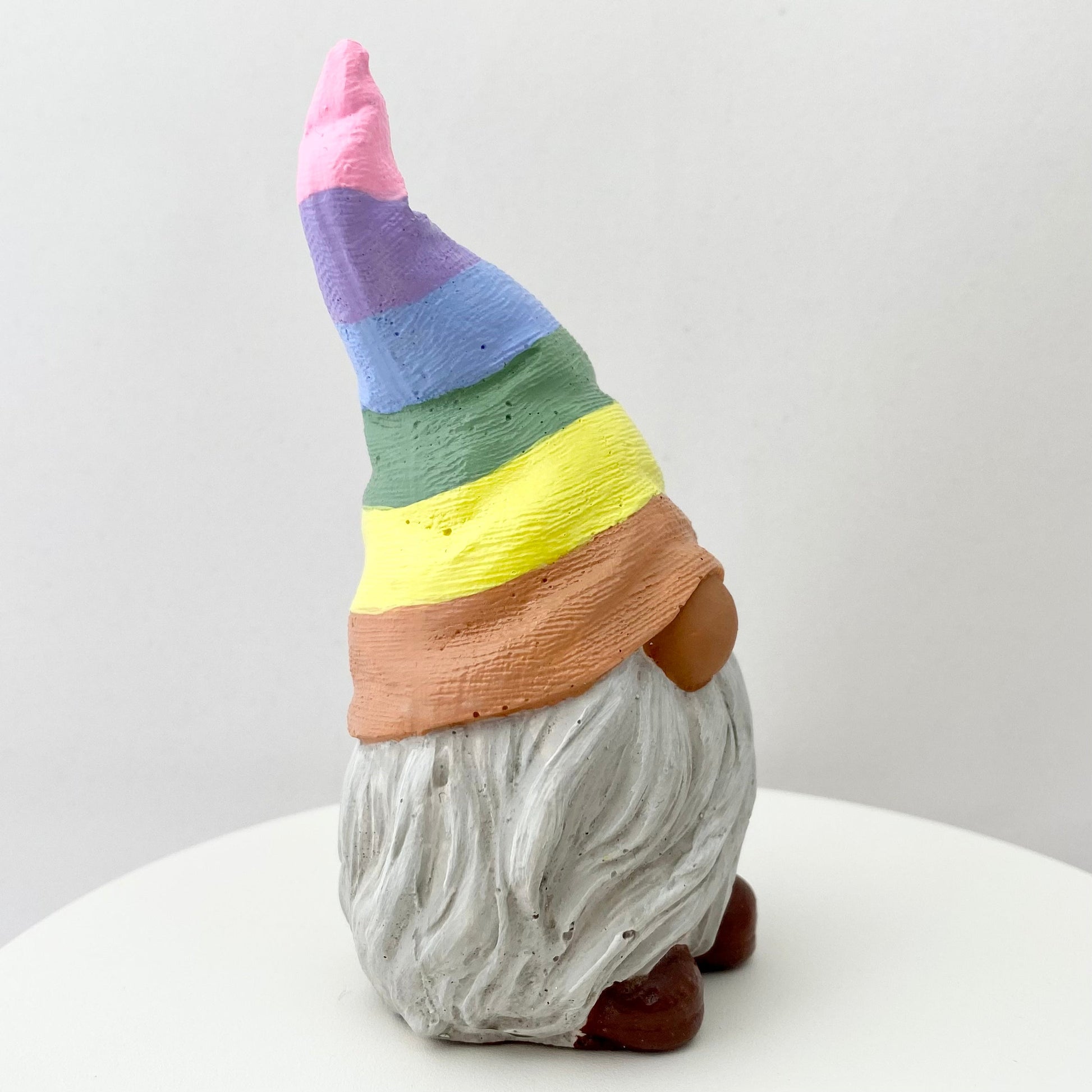 Hand painted Gonk statue with pastel rainbow striped hat