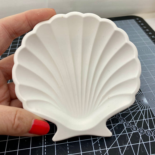 Hand Cast Plaster Shell Trinket Tray ready to paint. Being held to show size.