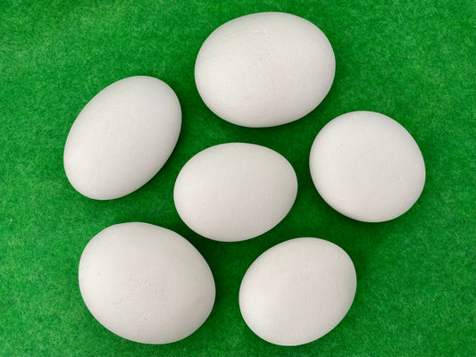 6 large white plaster pebbles of different shapes and sizes