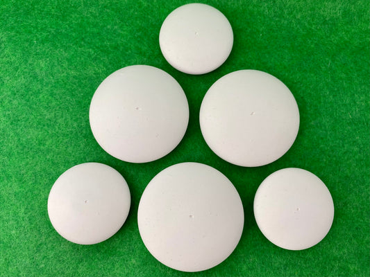 6 small white circular plaster pebbles in 2 sizes, each with a tiny centre hole to help with painting mandalas