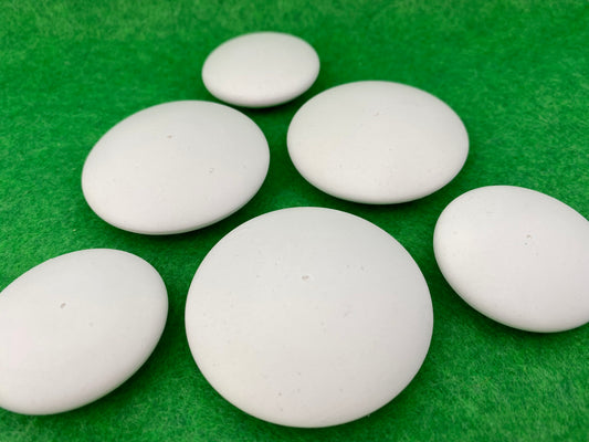 6 small white circular plaster pebbles in 2 sizes, each with a tiny centre hole to help with painting mandalas