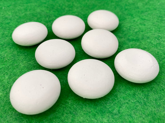 10 tiny white circular plaster pebbles