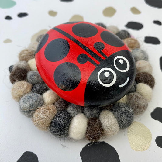 Hand painted Ladybug Pebble on a Felt Mat