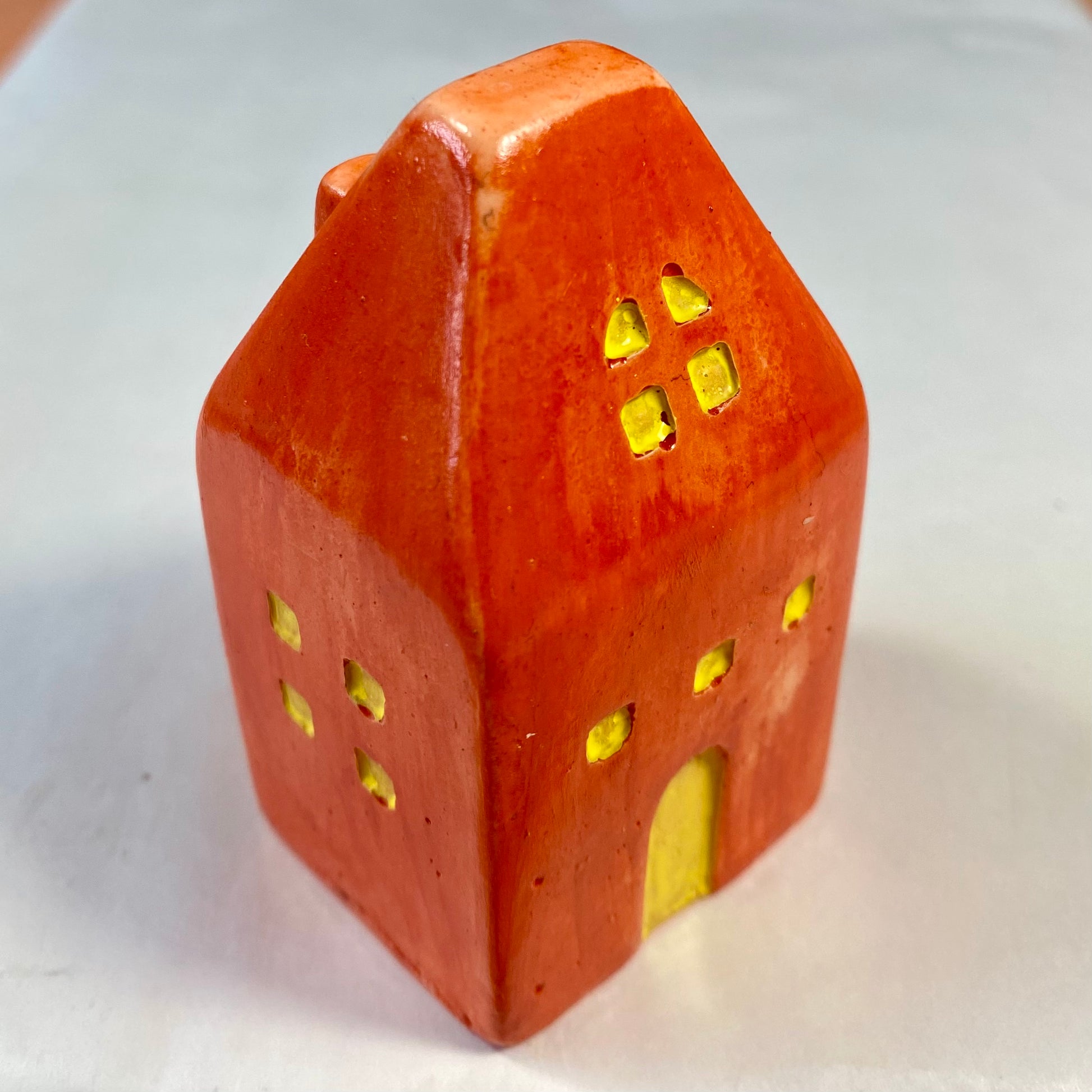 Hand Cast Plaster House painted orange.