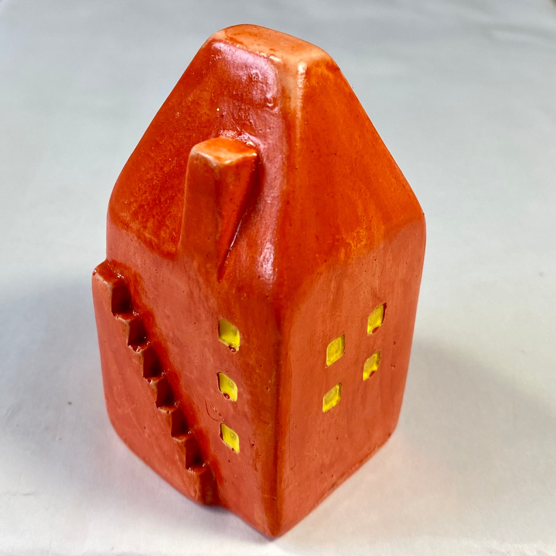 Hand Cast Plaster House painted orange.