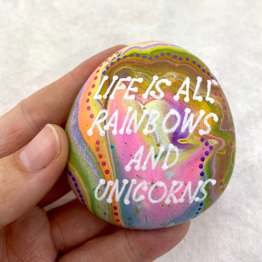 Colourful Hand painted Stone with the words Life is All Rainbows and Unicorns