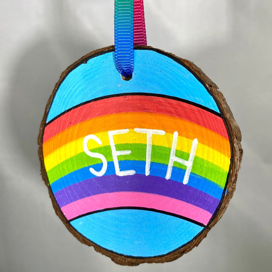 Hand painted hanging Wooden Slice with Rainbow and name Seth