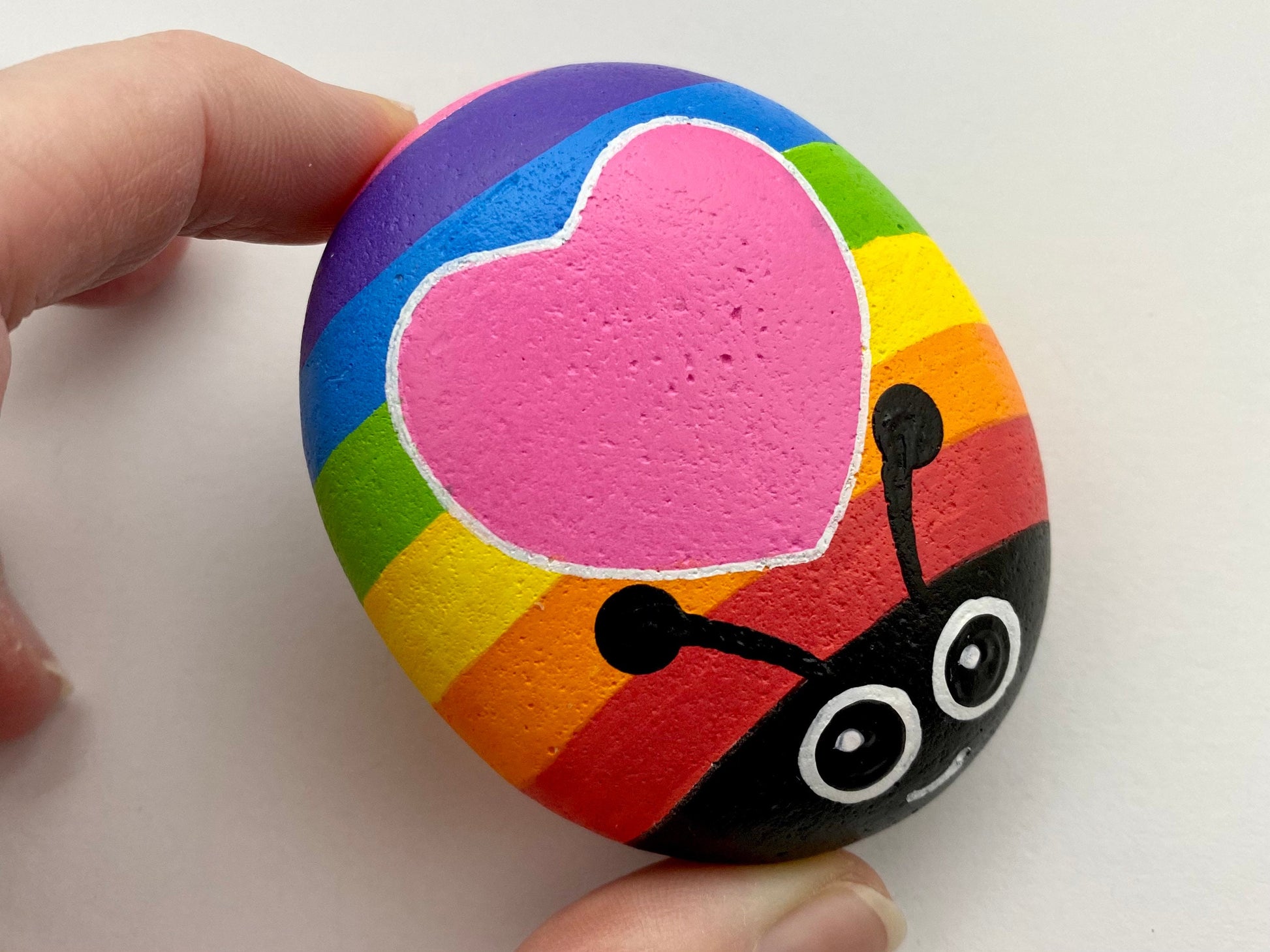 Hand painted Rainbow Bug with Heart Pebble